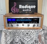 Marantz 2240 stereo receiver in WC-22 Style Ottawa Valley cherry cabinet — front view, silver faceplate and blue/red dial illumination.
