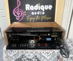 Pioneer SX-650 vintage stereo receiver in Ottawa Valley cherry cabinet — dial and tuning meters detail