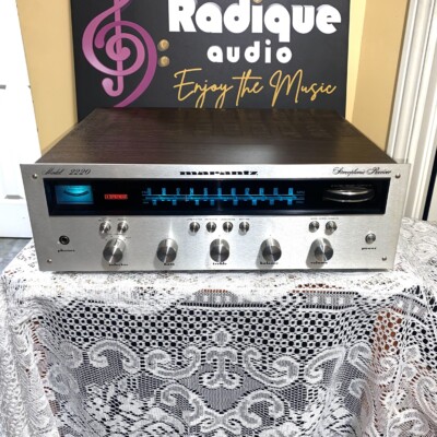 Marantz 2220 vintage stereo receiver in stock walnut veneer cabinet — front view, silver faceplate and blue dial illumination