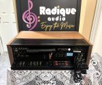Pioneer SX-650 vintage stereo receiver in Ottawa Valley cherry cabinet — dial and tuning meters detail
