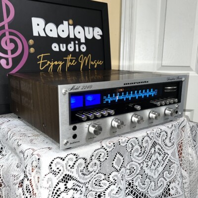 Marantz 2240 vintage stereo receiver, serviced — angled front view, silver faceplate with blue dial glow in the original walnut-finish case