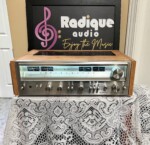 Pioneer SX-880 stereo receiver in Ottawa Valley cherry cabinet — front view, silver faceplate and illuminated twin power meters.