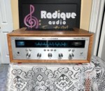 Marantz 2220 stereo receiver in custom Ottawa Valley cherry cabinet — front view, silver faceplate and blue dial illumination.