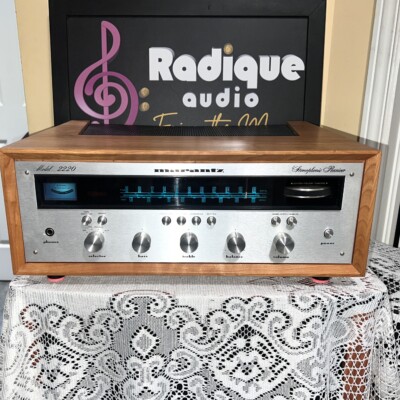 Marantz 2220 stereo receiver in custom Ottawa Valley cherry cabinet — front view, silver faceplate and blue dial illumination.