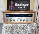 Marantz 2230 stereo receiver in custom Ottawa Valley cherry cabinet — front view, silver faceplate and blue dial illumination.