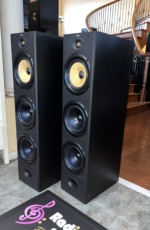 B&W DM604 S1 tower speakers, pair — angled front view of the driver array and black cabinets