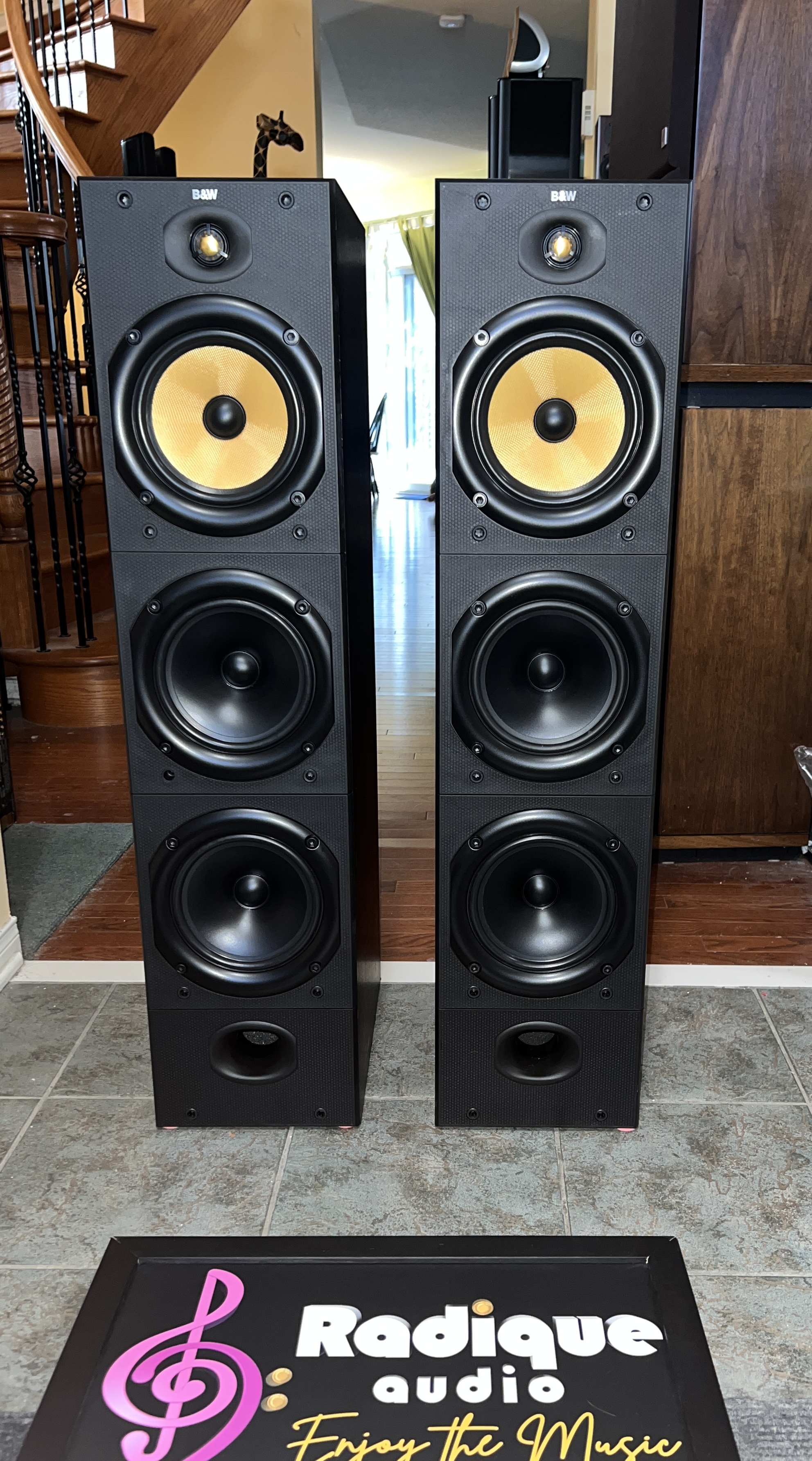 BW-DM604-S1-march-2026-04-1 B&W DM604 S1 Kevlar tower speakers, pair — front view showing the yellow Kevlar midrange drivers and dual woofers
