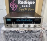 Marantz 2215B vintage stereo receiver — front-on view with silver faceplate and blue-lit tuner dial.