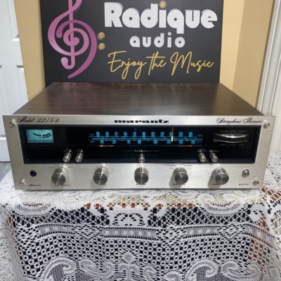 Marantz 2215B vintage stereo receiver — front-on view with silver faceplate and blue-lit tuner dial.
