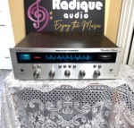 Marantz 2220 vintage stereo receiver in stock walnut veneer cabinet — front view, silver faceplate and blue dial illumination