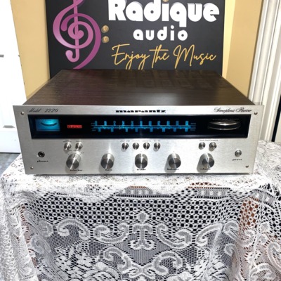 Marantz 2220 vintage stereo receiver in stock walnut veneer cabinet — front view, silver faceplate and blue dial illumination