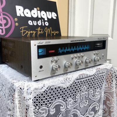 Marantz 2220 vintage stereo receiver in stock walnut veneer cabinet — angled front showing tuner dial and controls