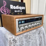 Marantz 2265 vintage stereo receiver in cherry cabinet — angled front, dial illumination