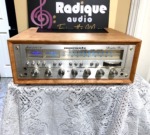 Marantz 2265B vintage stereo receiver in custom Ottawa Valley cherry cabinet — angled front view, silver faceplate with blue dial glow