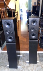 NHT Evolution T5 tower speakers, pair — angled room view showing full height on their powered subwoofer bases