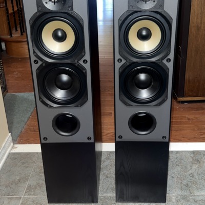 Paradigm Studio 60 v1 Reference towers in black ash, pair — front view of the driver array with gold-toned cones