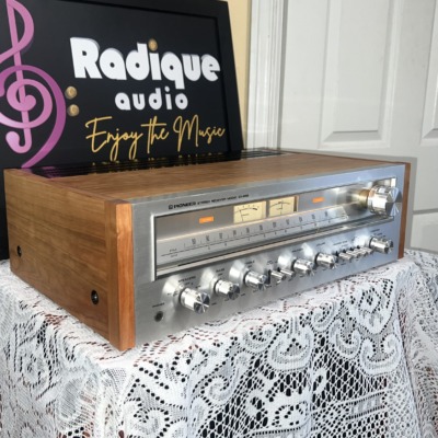 Pioneer SX-650 vintage stereo receiver in Ottawa Valley cherry cabinet — angled front showing cherry cabinetry