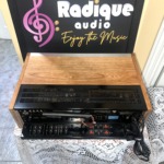 Pioneer SX-650 vintage stereo receiver in Ottawa Valley cherry cabinet — rear panel inputs and speaker terminals