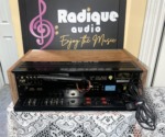 Pioneer SX-650 vintage stereo receiver in Ottawa Valley cherry cabinet — dial and tuning meters detail