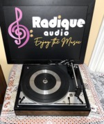Top-down view of the Dual 1214 showing the ribbed platter mat, tonearm, cueing lever and start stop speed control
