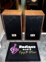 Rear panels of the Dynaco A-35 speakers, each with a white terminal plate carrying the NORMAL level switch and 8 ohm binding posts