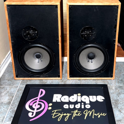Dynaco A-35 speakers in custom cherry cabinets, grilles off, showing black baffles with a large woofer below a recessed dome tweeter