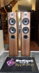 Focal Chorus 714V floorstanding speakers in Light Walnut, grilles off, each with an inverted dome tweeter above two midrange cones and a lower bass driver