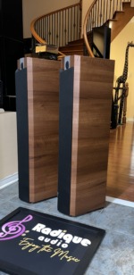 Focal Chorus 714V towers seen from the side with grilles on, full-height Light Walnut flanks and squared cabinet edges