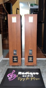 Rear of the JBL Northridge E80 towers in cherry, with the Northridge E Series model labels and bi-wire binding posts