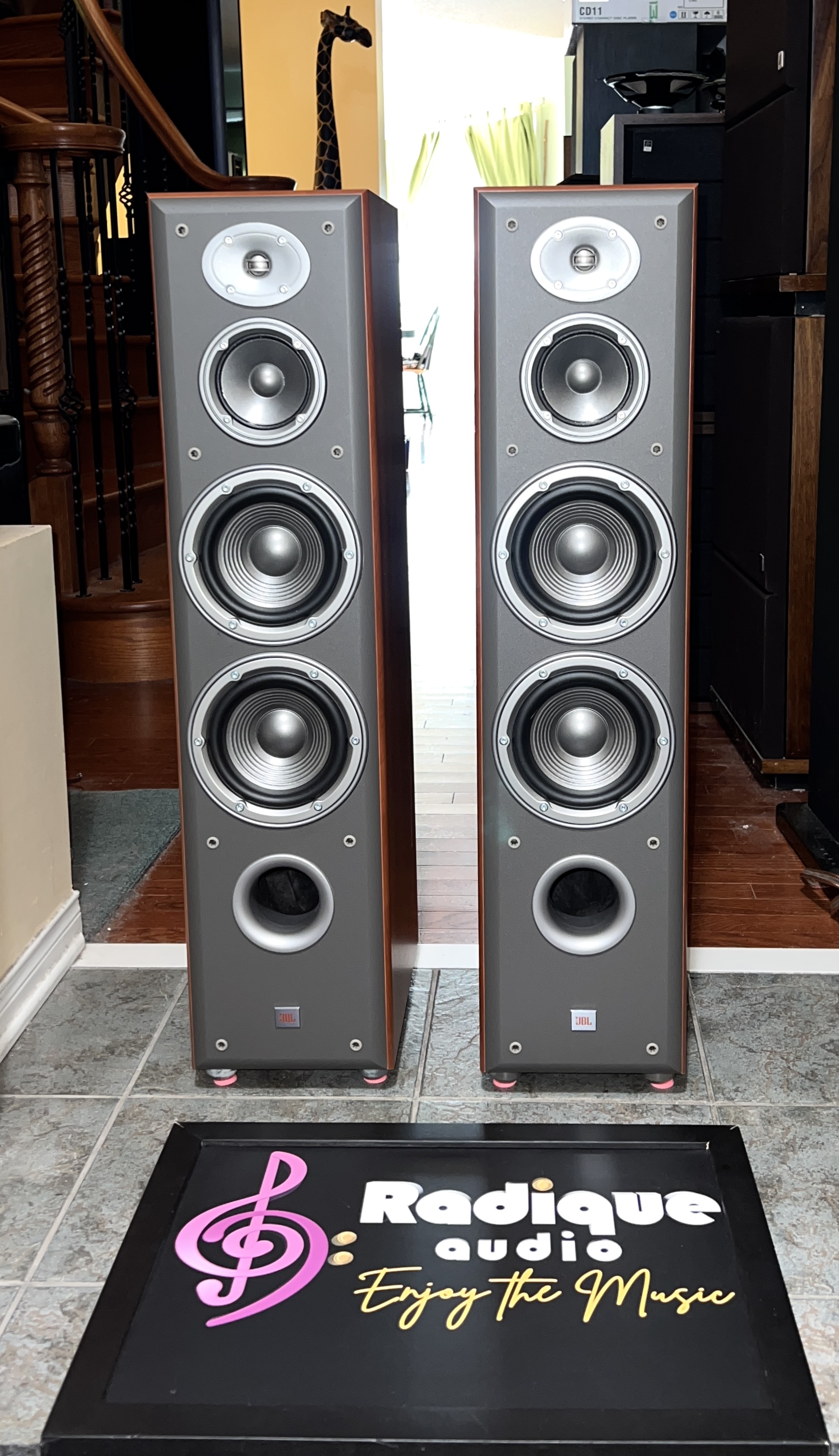 JBL-Northridge-E80-Floorstanding-Speakers-Cherry-Front Pair of JBL Northridge E80 tower speakers in cherry with grilles off, showing the tweeter, midrange, twin woofers and front port