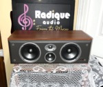 JBL Northridge EC35 centre channel speaker in cherry, grille off, twin woofers either side of the midrange and tweeter