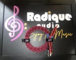 Pair of Kimber Kable 4PR speaker cables, 2 metres, braided red and black, coiled flat with banana plugs and bare-wire ends