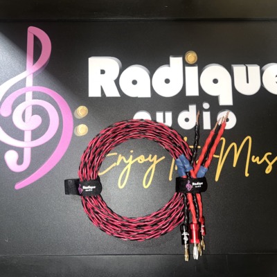 Pair of Kimber Kable 4PR speaker cables, 2 metres, braided red and black, coiled flat with banana plugs and bare-wire ends
