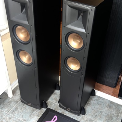 Pair of Klipsch RF-62 floorstanding speakers with grilles off, black ash cabinets, horn-loaded tweeter above twin copper woofers