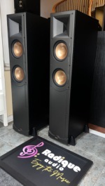 Klipsch RF-62 floorstanding speakers from the left with grilles off, horn tweeter above two copper woofers on each tower