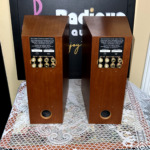 Rear panels of the Linn Katan speakers, each with the KATAN single-wire passive terminal plate, four gold binding posts and a bass port below