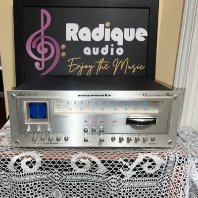 Marantz 2130 stereo tuner, brushed silver faceplate with the blue oscilloscope display, long blue-lit FM/AM dial and Gyro-Touch tuning wheel