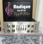 Marantz Model 1200 integrated amplifier front panel in brushed silver, with slider bass and treble controls, rotary knobs and a centre tape monitor switch