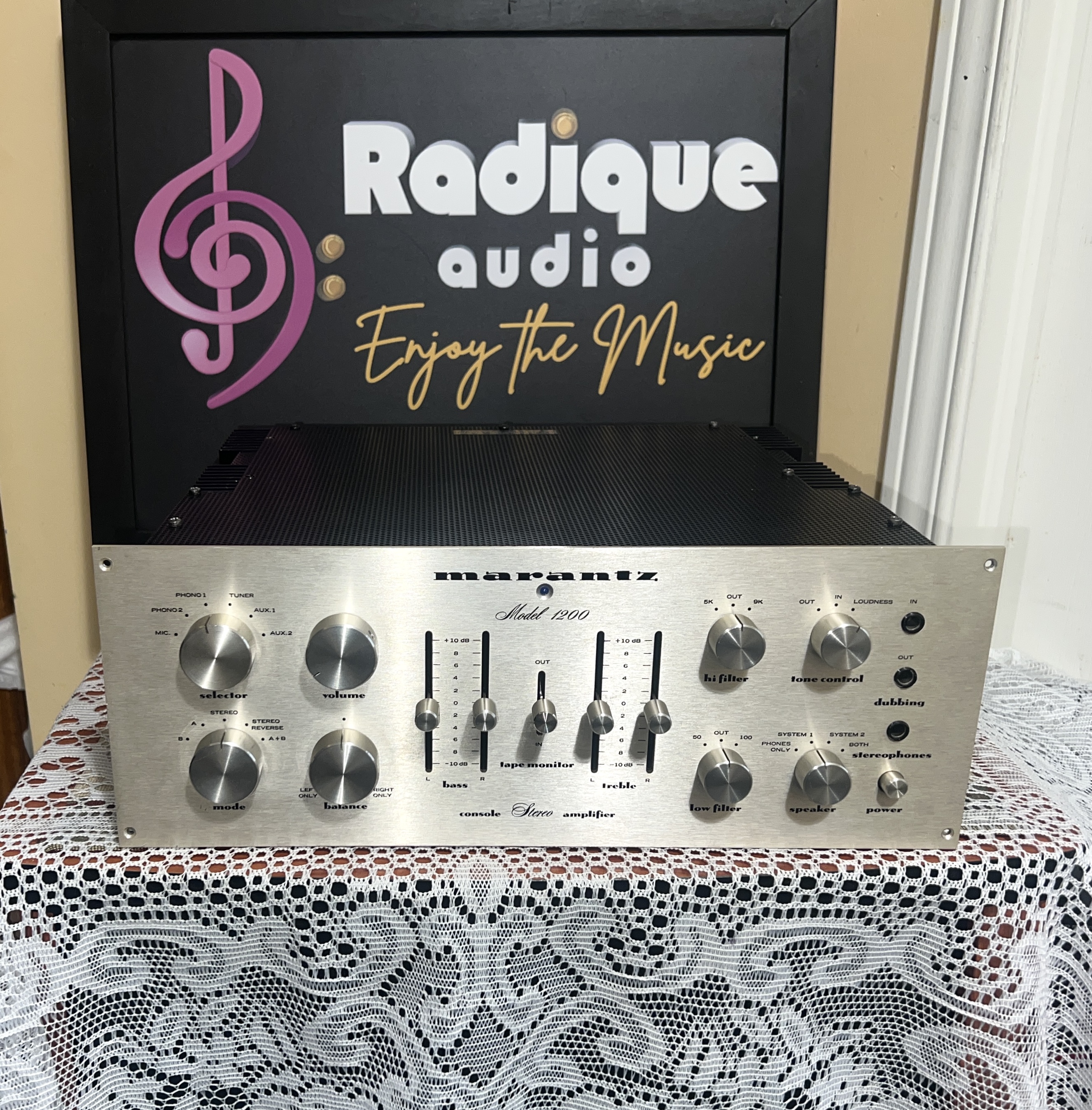 Marantz-Model-1200-Stereo-Integrated-Amplifier-Front Marantz Model 1200 integrated amplifier front panel in brushed silver, with slider bass and treble controls, rotary knobs and a centre tape monitor switch