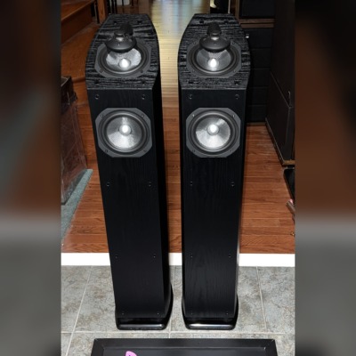 Pair of Mirage OMNI 350 tower speakers in black ash, grilles off, showing the omnipolar tweeters and woofers