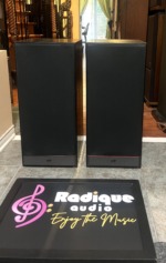 PSB 50 MkII speaker pair straight on with the black cloth grilles fitted and the PSB badge low on each front