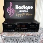 Pioneer CT-W650R stereo double cassette deck from the front in black, twin cassette wells either side of the lit display