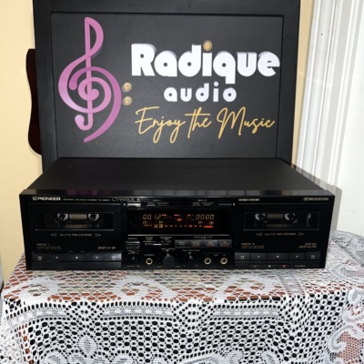 Pioneer CT-W650R stereo double cassette deck from the front in black, twin cassette wells either side of the lit display