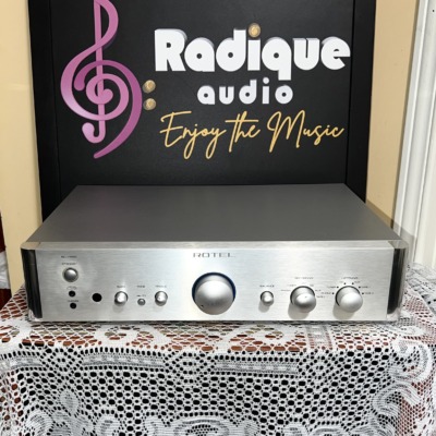 Rotel RC-1550 stereo preamplifier in silver, brushed front panel with central volume knob, bass, treble and balance controls