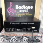 Rear panel of the Sansui SE-7 equalizer with input, tape-1 and tape-2 RCA pairs, output pair, a switched AC convenience outlet and the 120 V rating plate