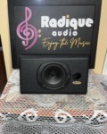 Tannoy D5C centre channel speaker in black ash, grille off, showing the woofer, tweeter and port