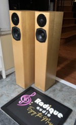 Totem Sttaf maple towers angled from the left, showing the slim cabinet and light maple veneer