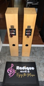 Rear of the Totem Sttaf speakers showing the rear ports, terminal plates and fitted Radique Audio bi-wire bridges