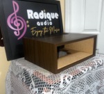 WC-10 walnut case at an angle on the lace table, open front and wood side panel with the Radique board standing behind it