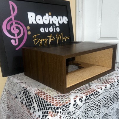 WC-10 walnut case at an angle on the lace table, open front and wood side panel with the Radique board standing behind it